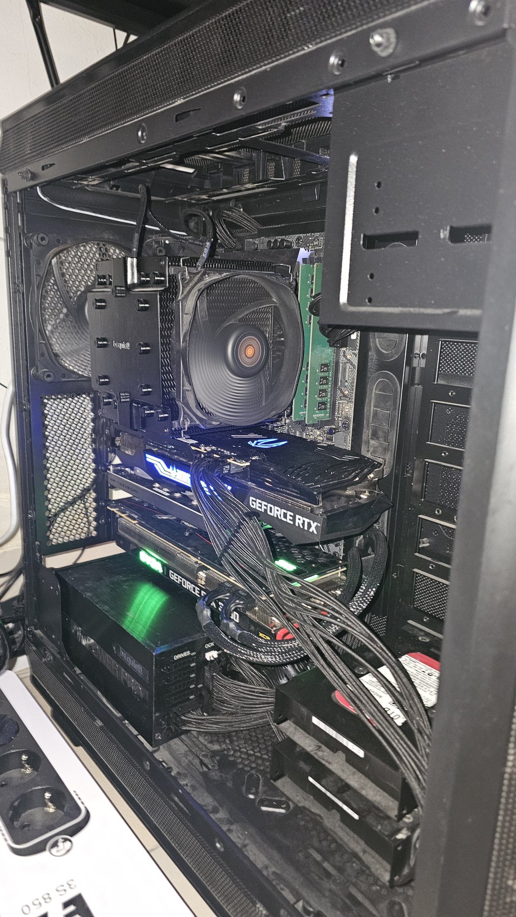 Top-down view into the finished machine showing both graphics cards, cooler and drive cage